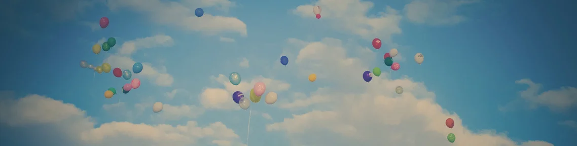 Colored balloons floating up.